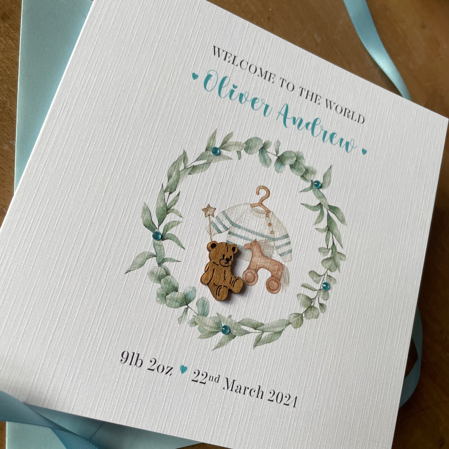 Personalised New Baby Boy Card, Wreath & Teddy - Blue - New Baby Grandson, Godson, Nephew